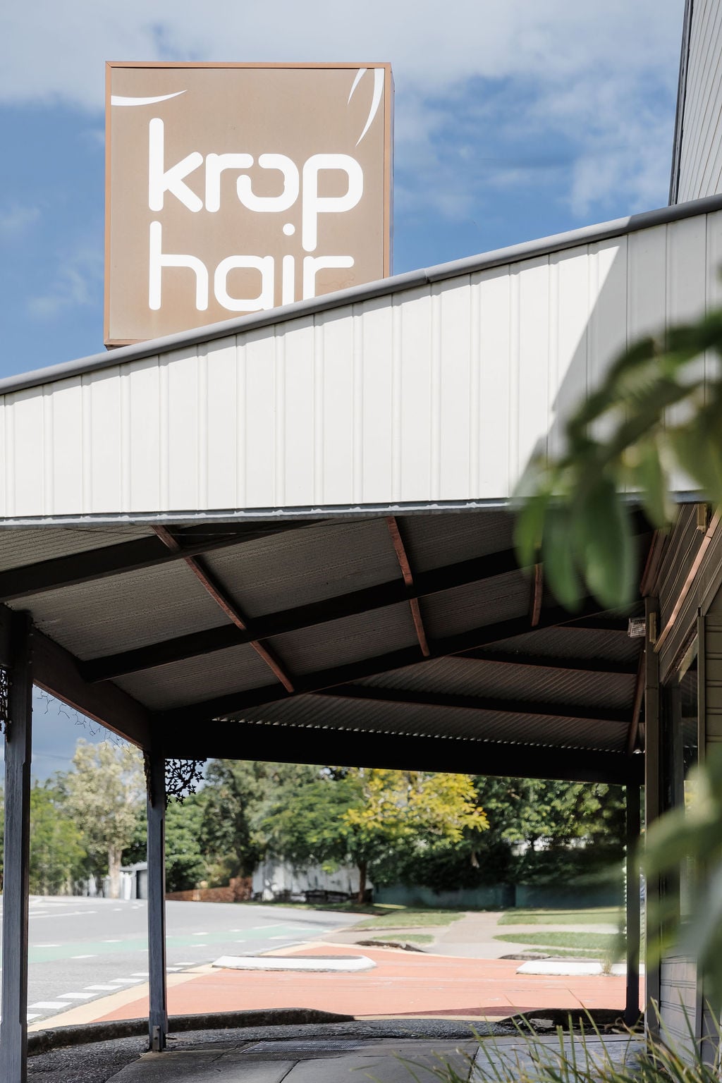 Krop Hair salon signage above the shopfront awning in Norman Park, Brisbane